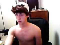 Handsome young twink is wanking off his dick